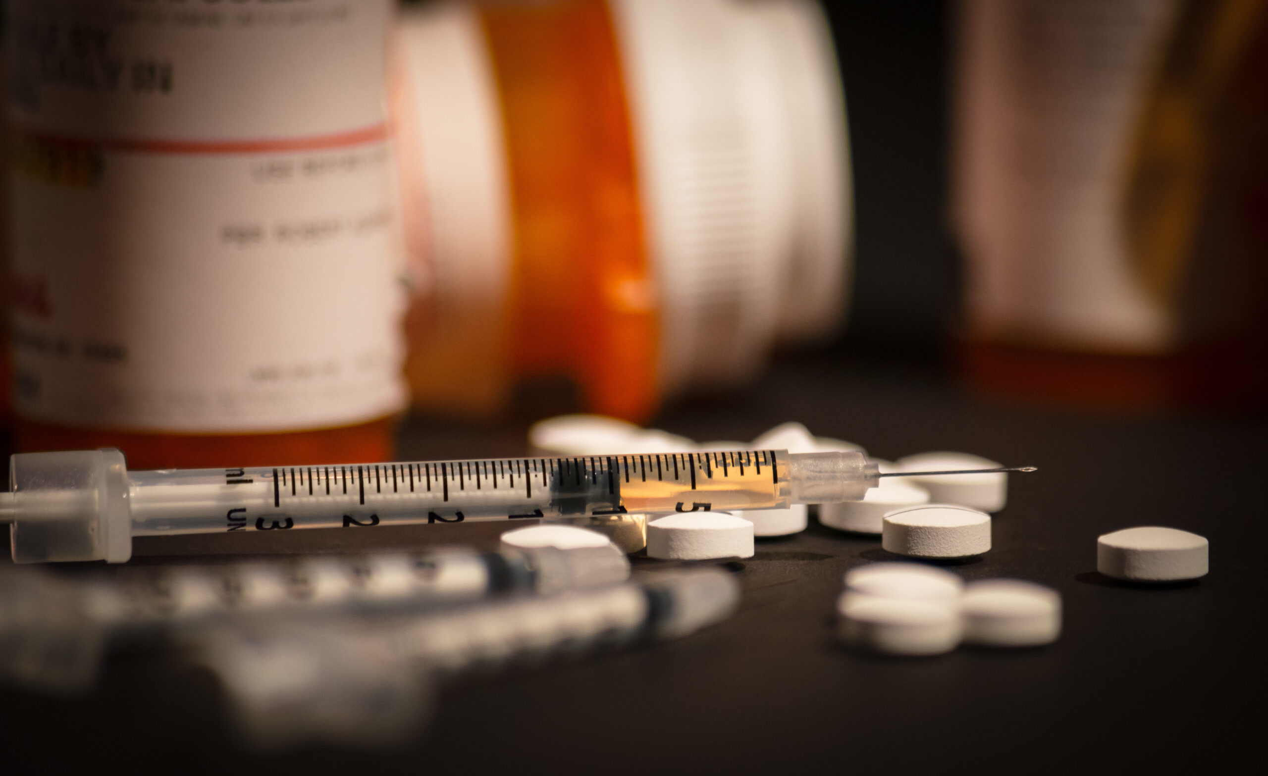Loaded Syringe and Pills Fentanyl