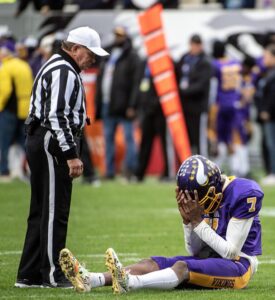 Tarboro’s Omarion Lewis sits on the ground in disappointment after throwing an interception during Saturday’s NCHSAA 1A football championship game against Tarboro in Raleigh. (PJ Ward-Brown / North State Journal)