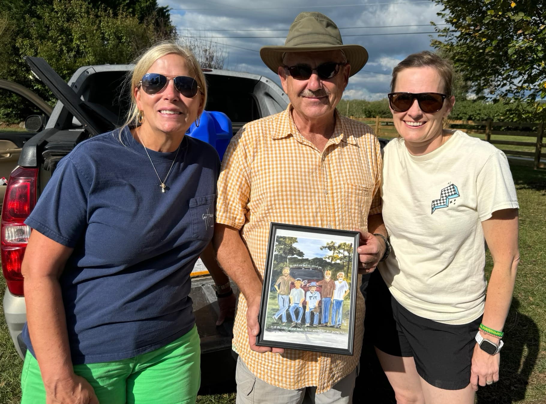 Melissa & Emily with man who helped during Florence